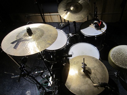 Tracking drums in a studio.